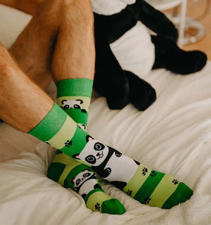 Qorapa LaraLara crew socks featuring a cute panda pattern and paw prints on light and dark green stripes