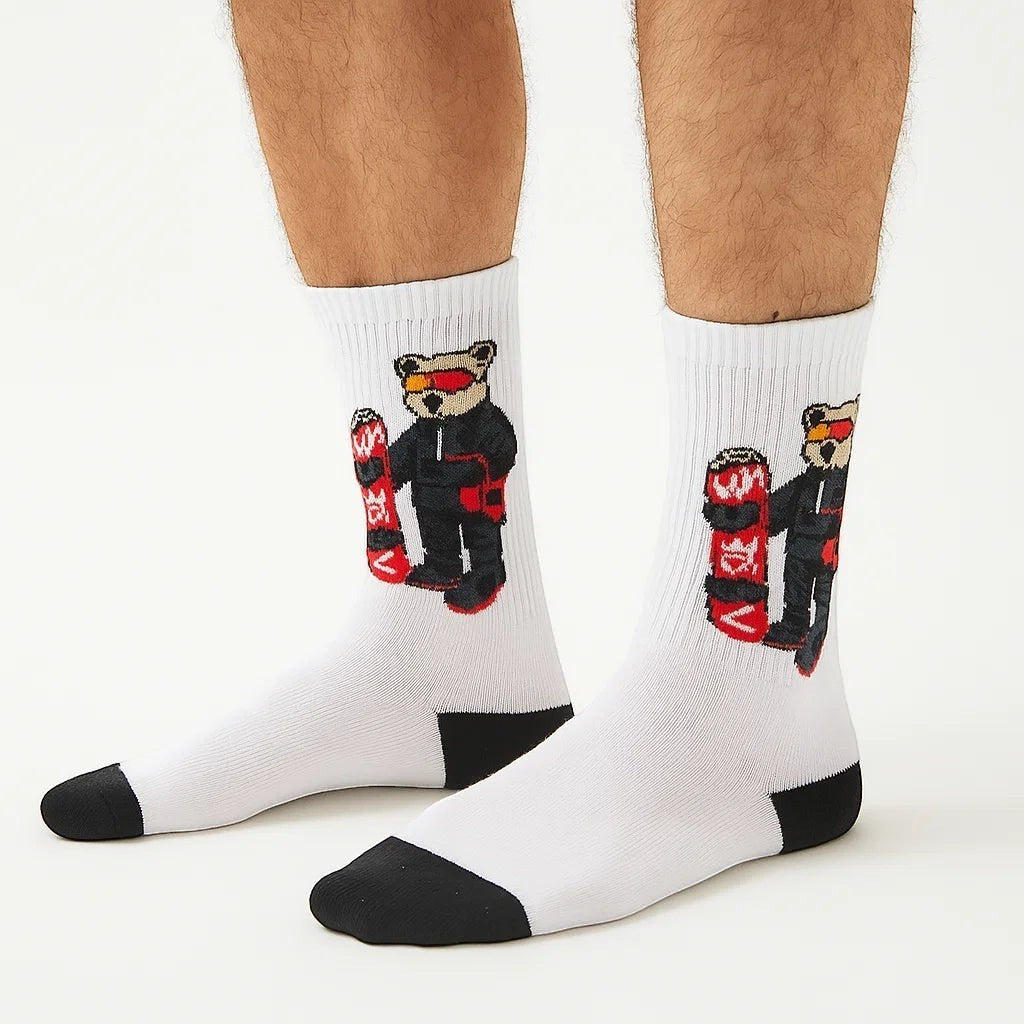Qorapa LaraLara white crew socks featuring a graphic of a snowboarder bear with black toe and heel accents