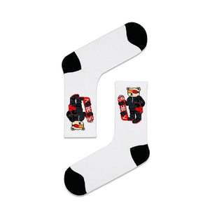 Qorapa LaraLara white crew socks featuring a graphic of a snowboarder bear with black toe and heel accents