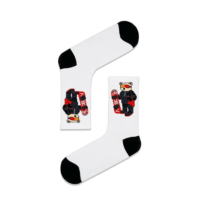 Qorapa LaraLara white crew socks featuring a graphic of a snowboarder bear with black toe and heel accents